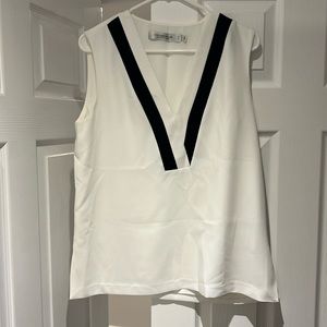 Simons Contemporaire top. Black and white varsity look. Crepe material. Size M